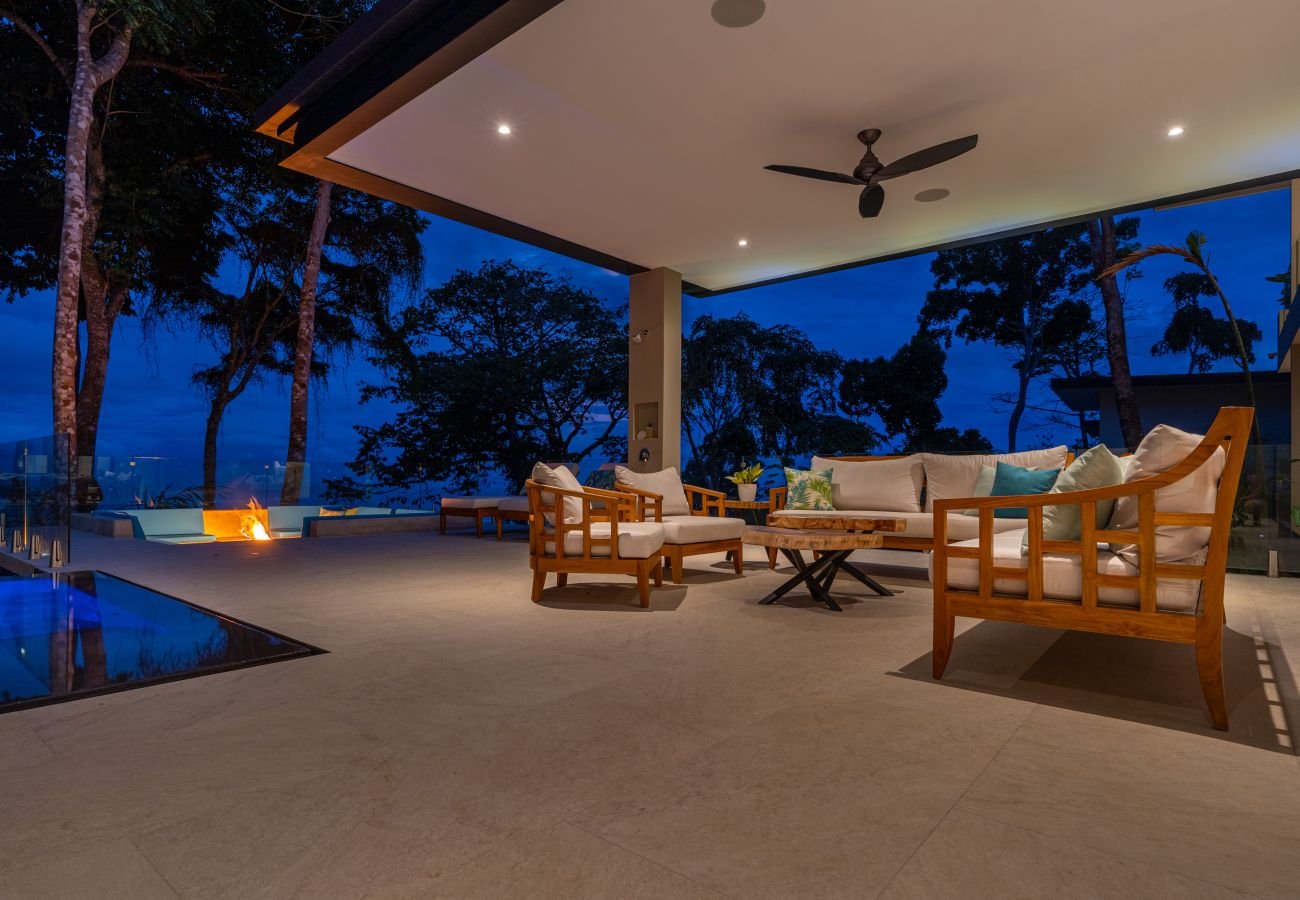 The sunken firepit lounge set over the ocean view beside the pool