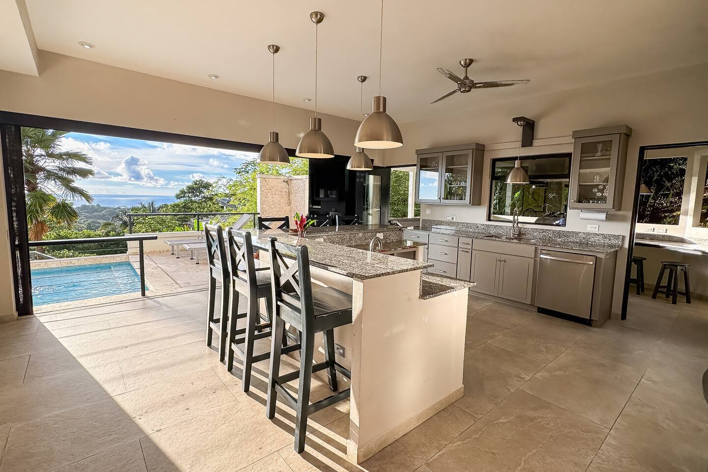 Villa Cielo Azul — The open-air kitchen beside the pool