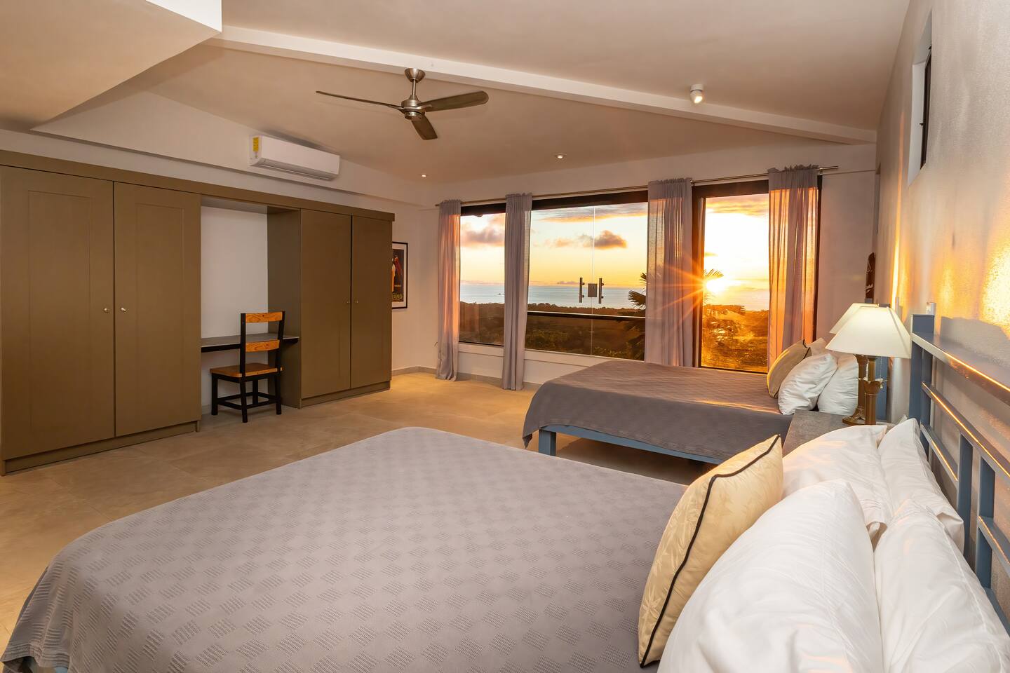 Villa Cielo Azul — An ocean-view bedroom with two queen beds